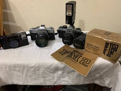 Vintage Film Cameras - Nikon FM2, Nikon L35AD, Minolta SRT (As-Is)