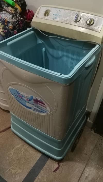 bright washing machine in working conditions