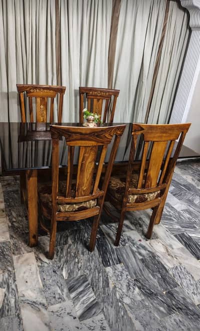 Wood dining table with heavy glass