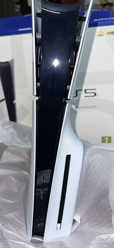 Playstation 5 Slim disc edition with extra black controller.
