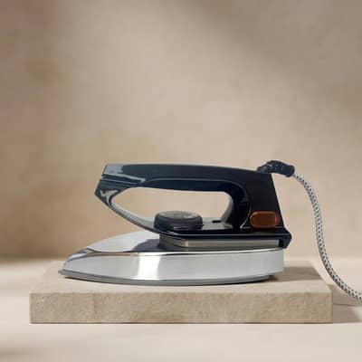 Electric dry iron black stainless steel pakistan