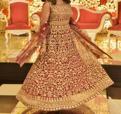 Beautiful Maroon Maxi Lehenga Frock with Heavy Gold Work.