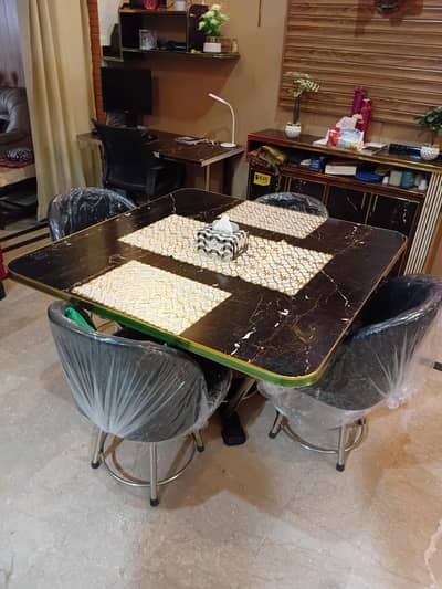 dining table with 4 cushion chair steel