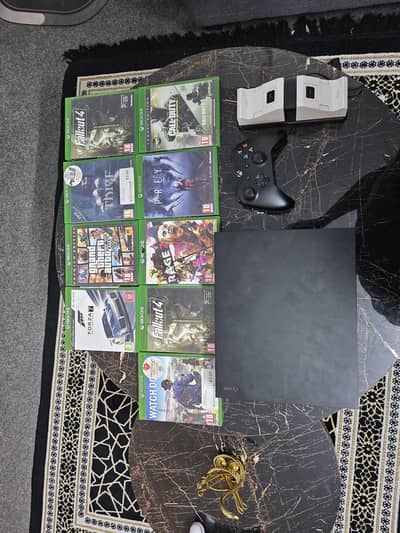 Xbox one x 1TB  with 9 dvds
