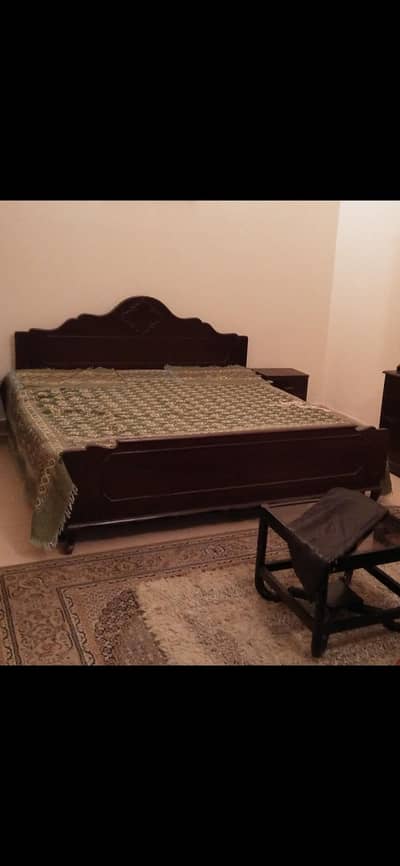 king size bed with one side table without mattress