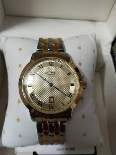 This is a Rotary 1895 two-tone gold and silver watch water proof