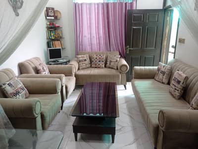 7 seater sofa set + 2 wooden Tables with glass top size 2 by 2. ft