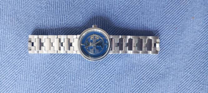 Tory Burch Reva Watch (specifically reference TRB4010 ).