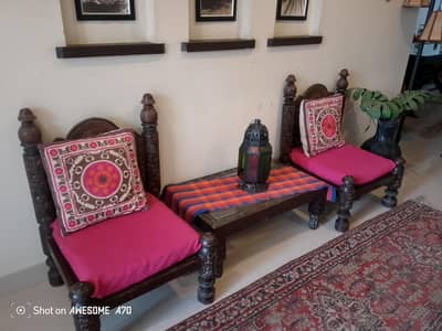 two chairs with centre table