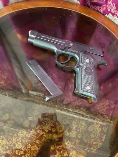 it's a metal toy gun and looks like real