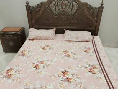 it is a wood bed and king size and 2 second hand