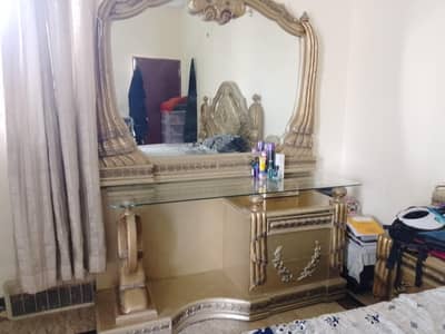 bed, dressing table and cupboard