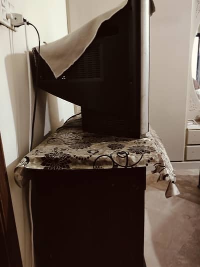 A. s. . a  LG  Tv   21 " inch . . with TV trolly.