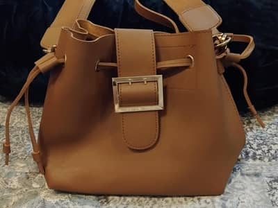 Tan Bucket Bag with Gold Buckle – Like New