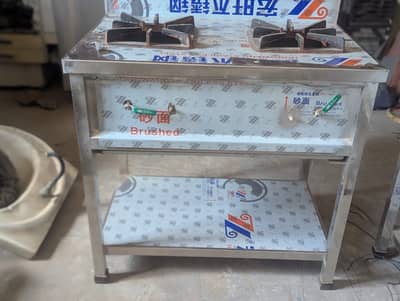 3 stainless steel double burners stove and 1 fryer of 25 litters