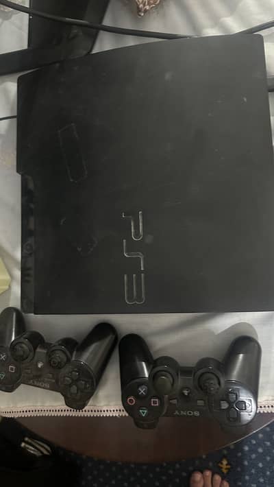 PLAYSTATION 3 SLIM (ps3) with two controllers