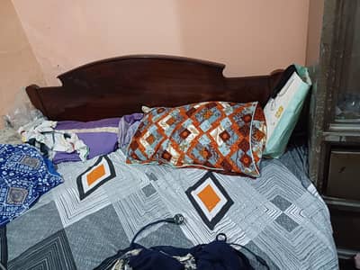 wooden bed without mattress