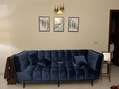 Blue three seater sofa