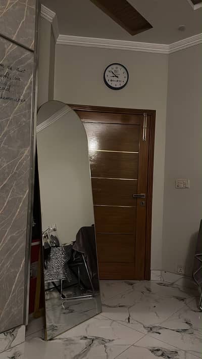 Full length golden arch mirror