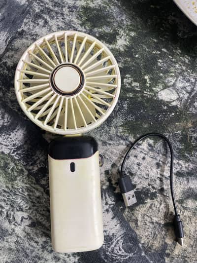 Small portable hand fan