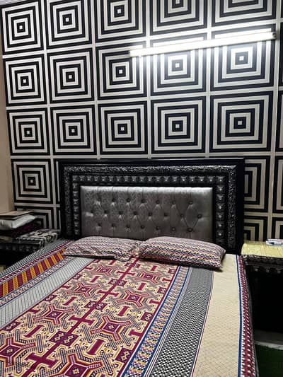 Wooden bed with two sides tables
