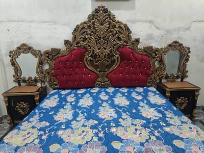 King sized bed with side tables and dressing table