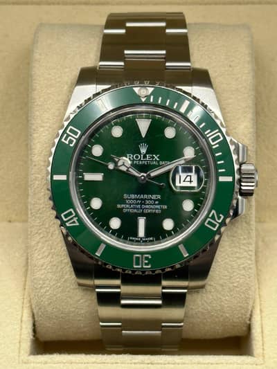 mint condition Rolex submariner. green dial . scratchless condition. .