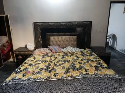 king size bed with side table and dressing table