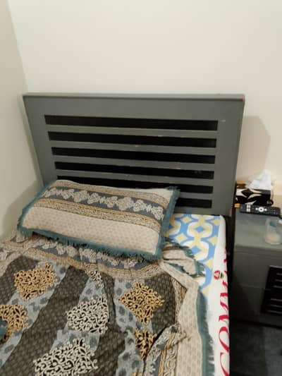 wooden bed and side table