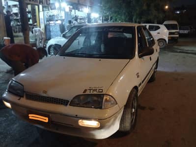 White Suzuki Margalla Urgent