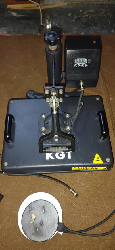 A 5-in-1 combo heat press machine for t-shirts, mugs, caps, and plates
