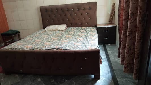 Double bed with one side table and matress