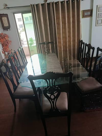 heavy glass dinning table with 8 chairs