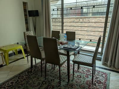 Glass Dining Table with 6 cushioned chairs