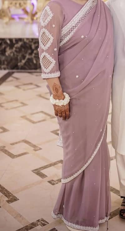 Elegant Dusky Mauve Saree with heavy pearl & silver Border.