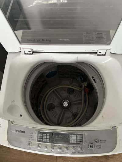 LG T1007TEFT0, a 10 kg fully automatic top-load washing machine.
