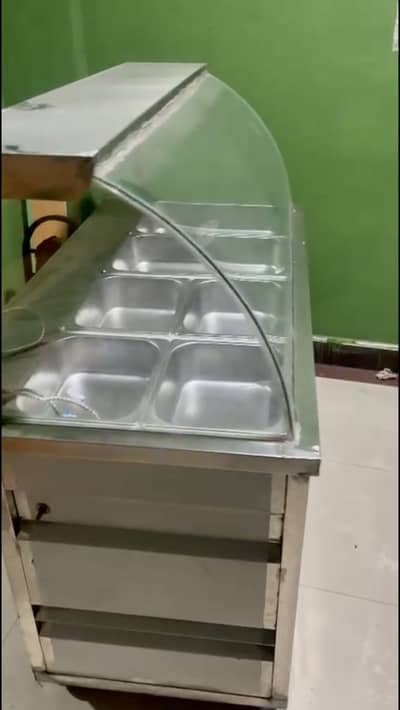 Hot food   Counter with steel dishes