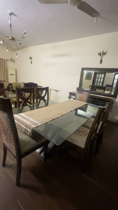 6 seater dining table with pure wood base and heavy glass