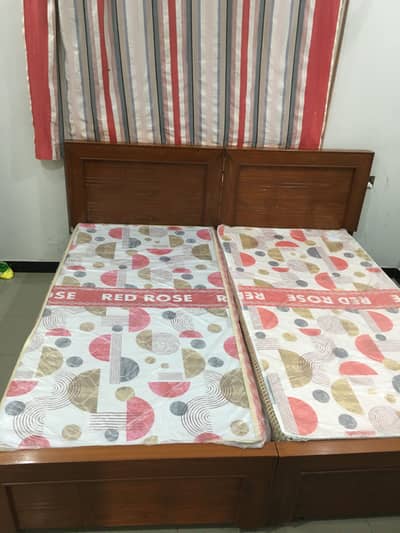 2 Single beds with mattress