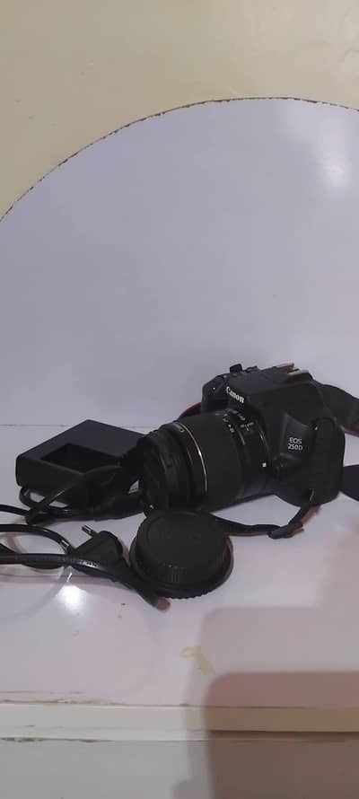 Canon 250d 4k dslr camera with 18-55mm iii lens and accessories.