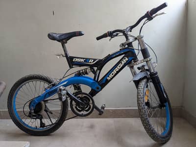Morgan dual-suspension MTB with "Oskar" branded accents