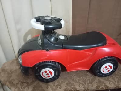 Kid toy stearing moving car (Pushing car)
