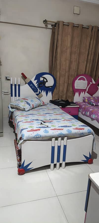 2 single beds , 1 side table , dressing table and 3 door cupboard