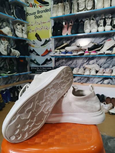 white sneakers branded 10/10 conditions