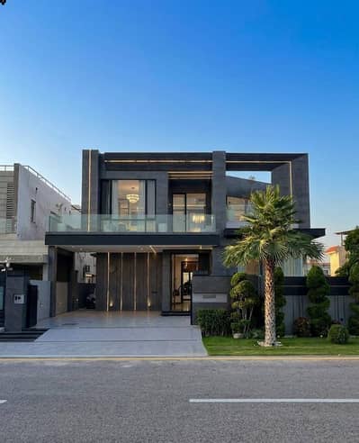 SYED BROTHERS PROUDLY OFFERS: 1-Kanal Elegant And Fully Maintained Modern Bungalow Is Available In The Best Block Of DHA Lahore.