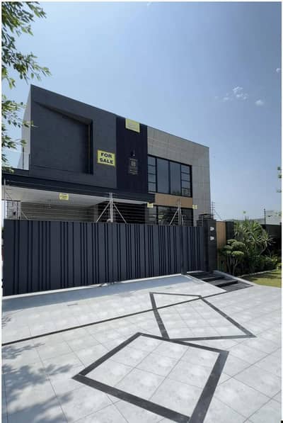 SYED BROTHERS PROUDLY OFFERS: 1 Kanal Modern House For Sale in DHA Phase 6 | With Full Basement & Theater.
