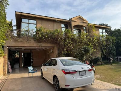 SYED BROTHERS PROUDLY OFFERS: 2-Kanal Elegant And Fully Maintained Bungalow Near To The Club, Ring Road & Airport Is Available In The Best Block Of DHA Lahore.