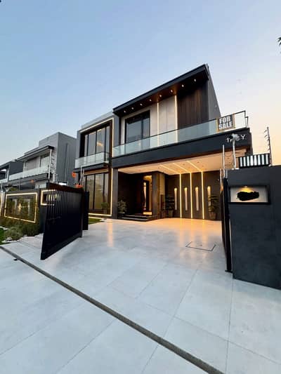 SYED BROTHERS PROUDLY OFFERS: 1-Kanal Elegant And Fully Maintained Modern Bungalow Near To McDonald's Is Available In The Best Block Of DHA Lahore.