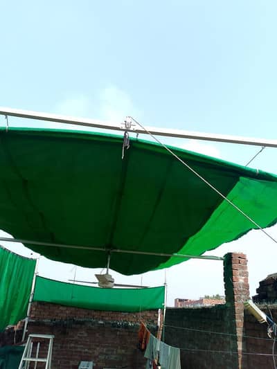 green cloth shade which's ( 12.5 width and 22 feet length )