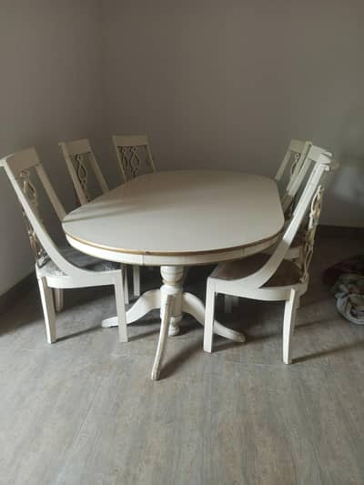 6-seater dining table with 6 matching chairs.